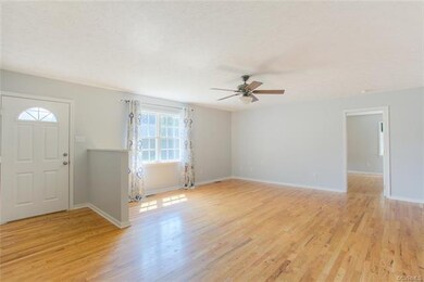Family Room featuring hardwood flooors - large win