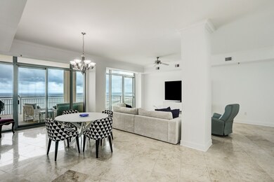 Living area with high ceilings, travertine floors,