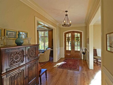 This home features an open entry with living and d