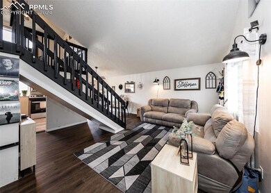 Living room with plenty of natural light and dark 