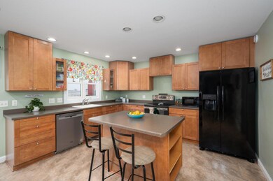Open kitchen with lots of cabinets and an island