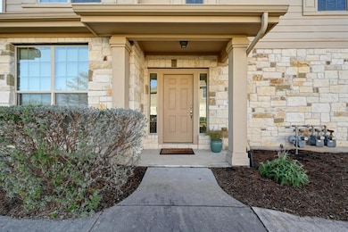 View of exterior entry with stone siding