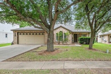 Ranch-style house featuring concrete driveway, br