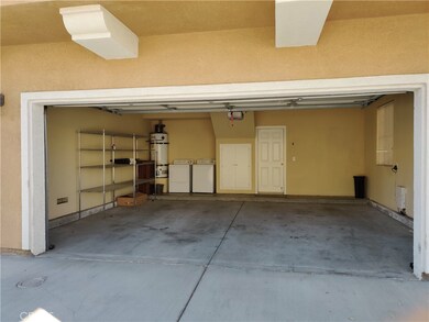 Spacious 2 car remote attached garage with laundry hookups.