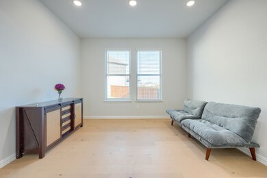Sitting room with recessed lighting and wood finished floors