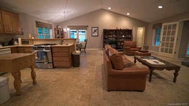 Kitchen/dining/living area with vaulted ceilings