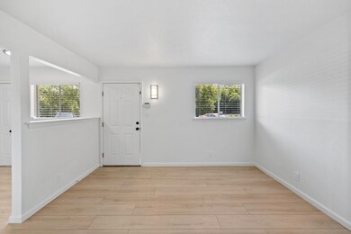 Foyer entrance with light wood-type flooring and 