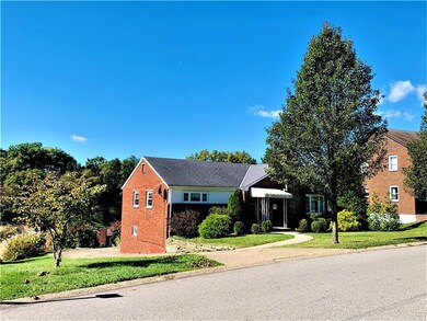 The level entry brick ranch is bordered to the lef