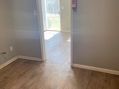 Hallway featuring wood-type flooring