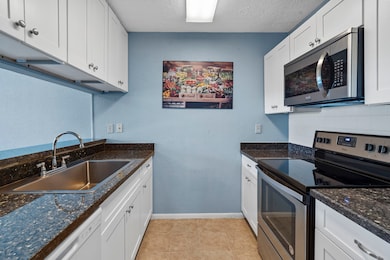 This charming galley-style kitchen offers a functi