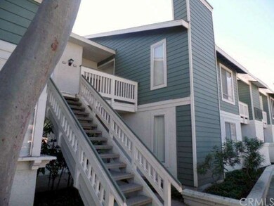 Upper Level, one-story, two-bedroom unit with tree