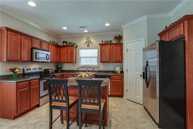 View of kitchen with island.  The door on the right opens to a large pantry.