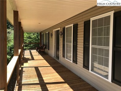 Large covered porch 8 x 44 runs the full length of