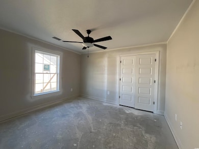 Unfurnished bedroom featuring a textured ceiling, 
