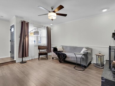 Sitting room featuring light hardwood / wood-style