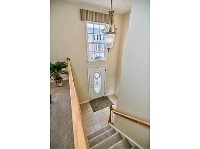 Entry/Foyer. The sunlit foyer sets the stage...