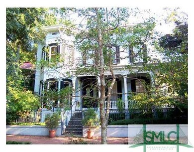 Exterior Front. The home is surrounded by a brick 