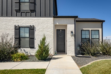 Entrance to property with brick siding