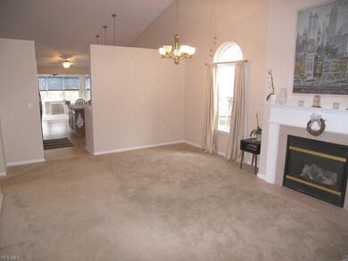 Dining room with shared gas fireplace with the liv