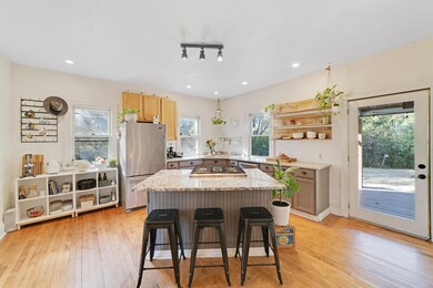 The updated kitchen is sure to get you cooking with ample storage and cabinet space, newer appliances and a granite island.