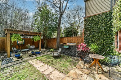 Tranquil backyard oasis is centered around a woode