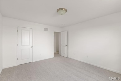 Unfurnished bedroom featuring carpet and baseboards