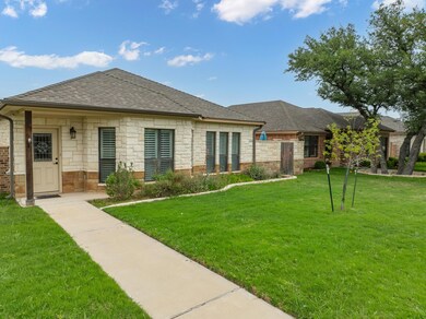 View of front of home featuring a shingled roof, 