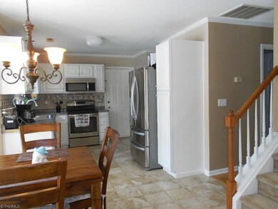 Wonderful kitchen with open floor layout, new lighting and tile flooring.