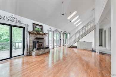Unfurnished living room with a skylight, plenty of