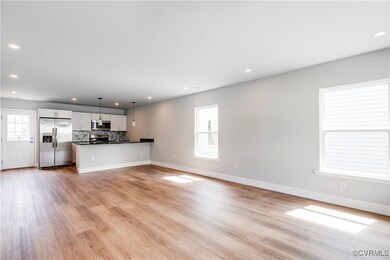 Unfurnished living room featuring recessed lightin