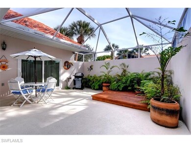 Planting area along with a deck, gas grill and pat