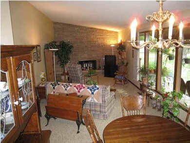 Living & Dining Combo With Windows Out Back