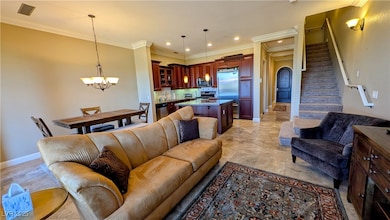 Living area featuring visible vents, baseboards, s