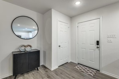 Entrance foyer featuring light wood-type flooring 