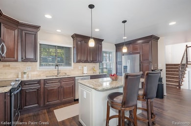 Updated kitchen with stainless steel and granite.