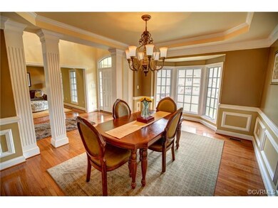 Gorgeous formal dining room with square entry colu