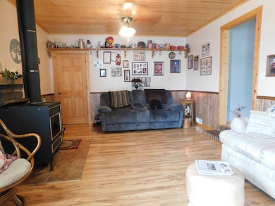 Relax and enjoy your evening and weekends in front of your wood burning fireplace.  Access your large laundry room and storage from your den.