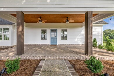 View of patio featuring ceiling fan