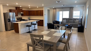 Dining space featuring light tile patterned flooring and recessed lighting