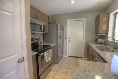 Galley kitchen with granite