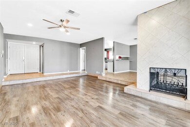 Unfurnished living room featuring baseboards, visi