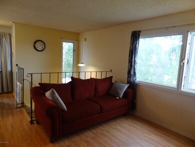 Living rm toward dining area & entry