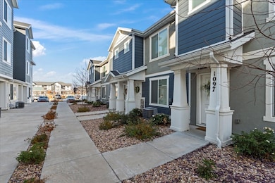 View of side of home with a residential view and a central air condition unit