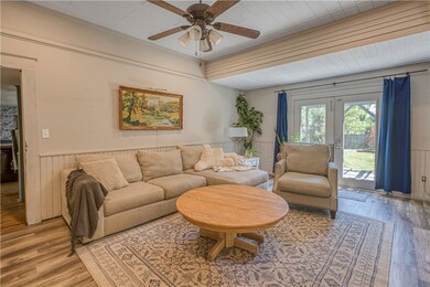 Living Room opens to patio and pool area.