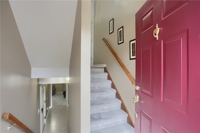 The lower level family entrance is spacious and the main level foyer is sun filled.