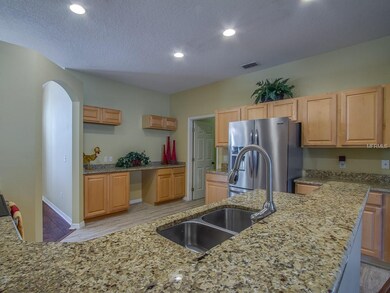 Tons of cabinets, granite, ss appliances, work spa