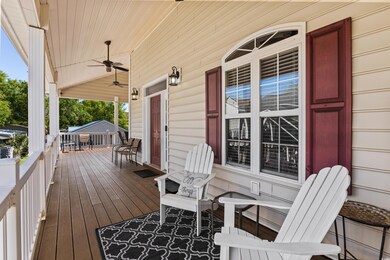 Wooden terrace with a porch and ceiling fan
