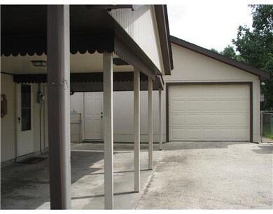 Parking Lot/Garage. Side patio and garage
