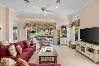 Living room featuring crown molding, carpet floors, recessed lighting, and ceiling fan