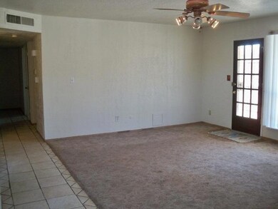 Living Room. Living area opens to back p